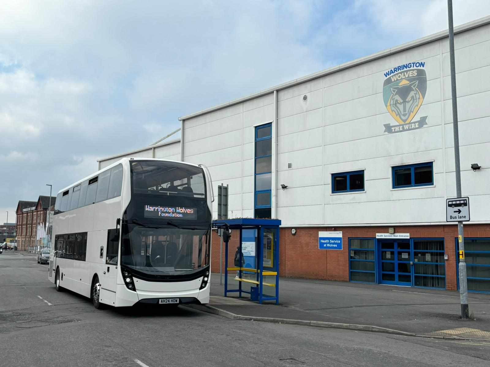Omega Busways bus outside the Halliwell Jones stadium.