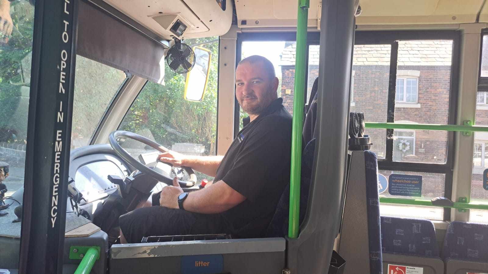 Rob at the wheel of his bus on Route 10